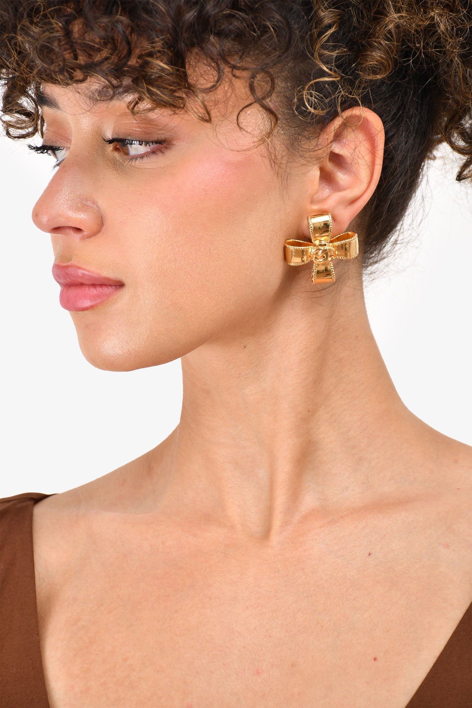 Chanel™ 97A Gold Tone Coco Mark Cross Ribbon Clip-on Earrings