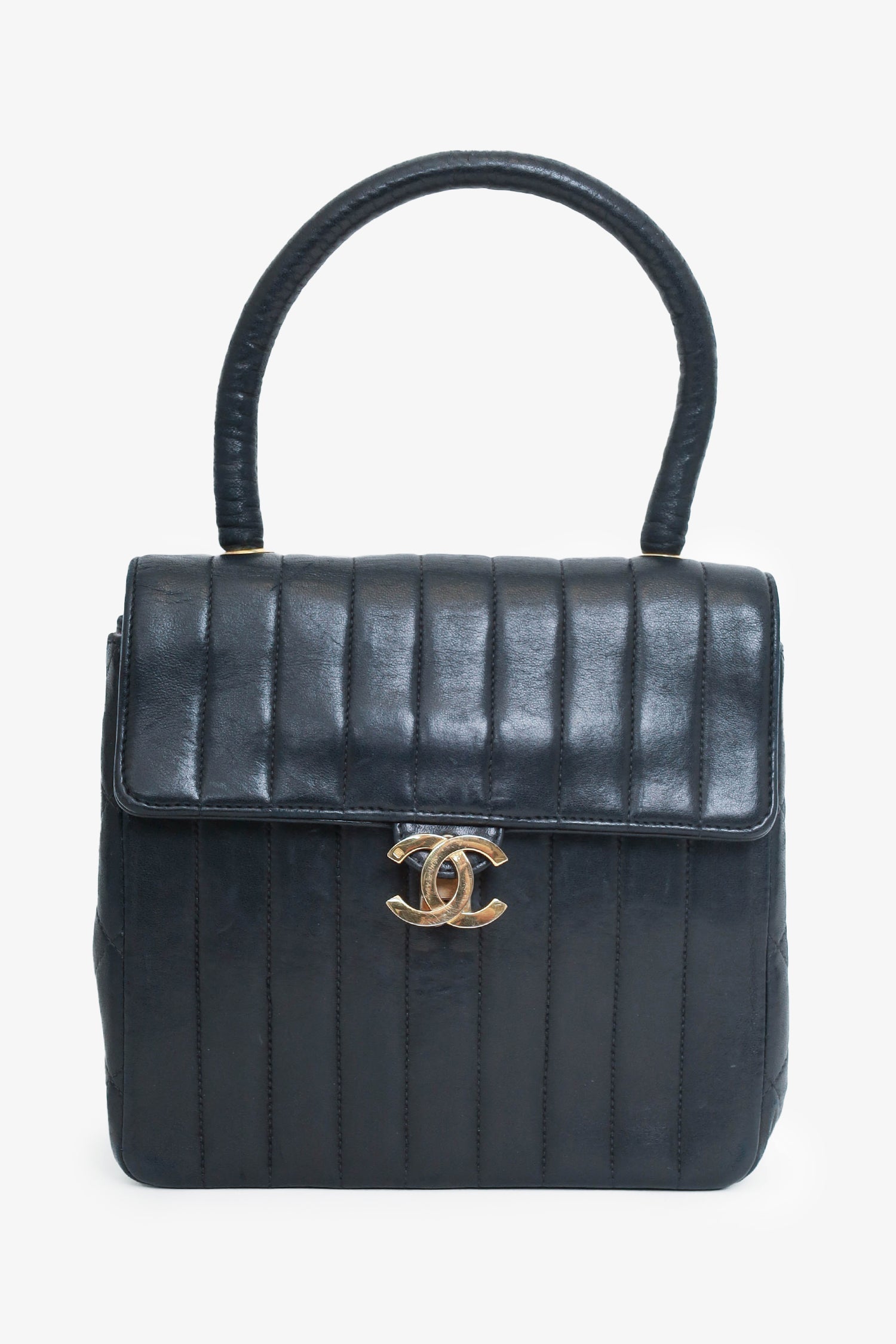 Chanel™ 1991-94 Black Vertical Quilted Lambskin Top Handle Bag