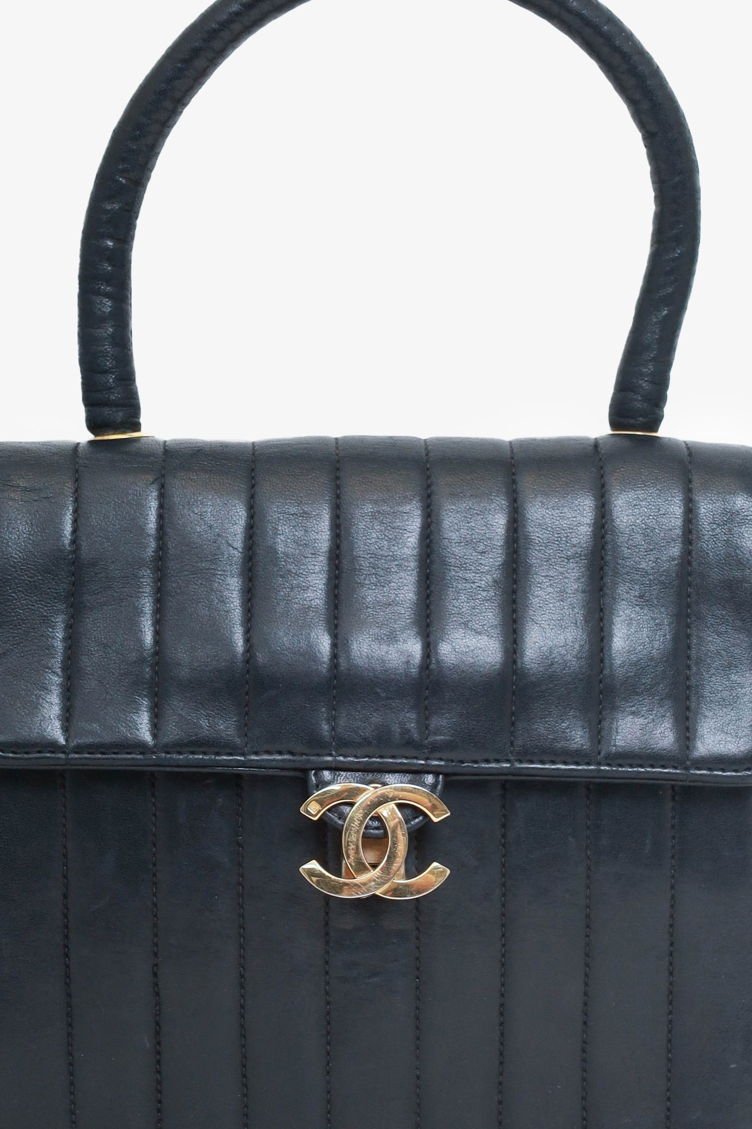 Chanel™ 1991-94 Black Vertical Quilted Lambskin Top Handle Bag