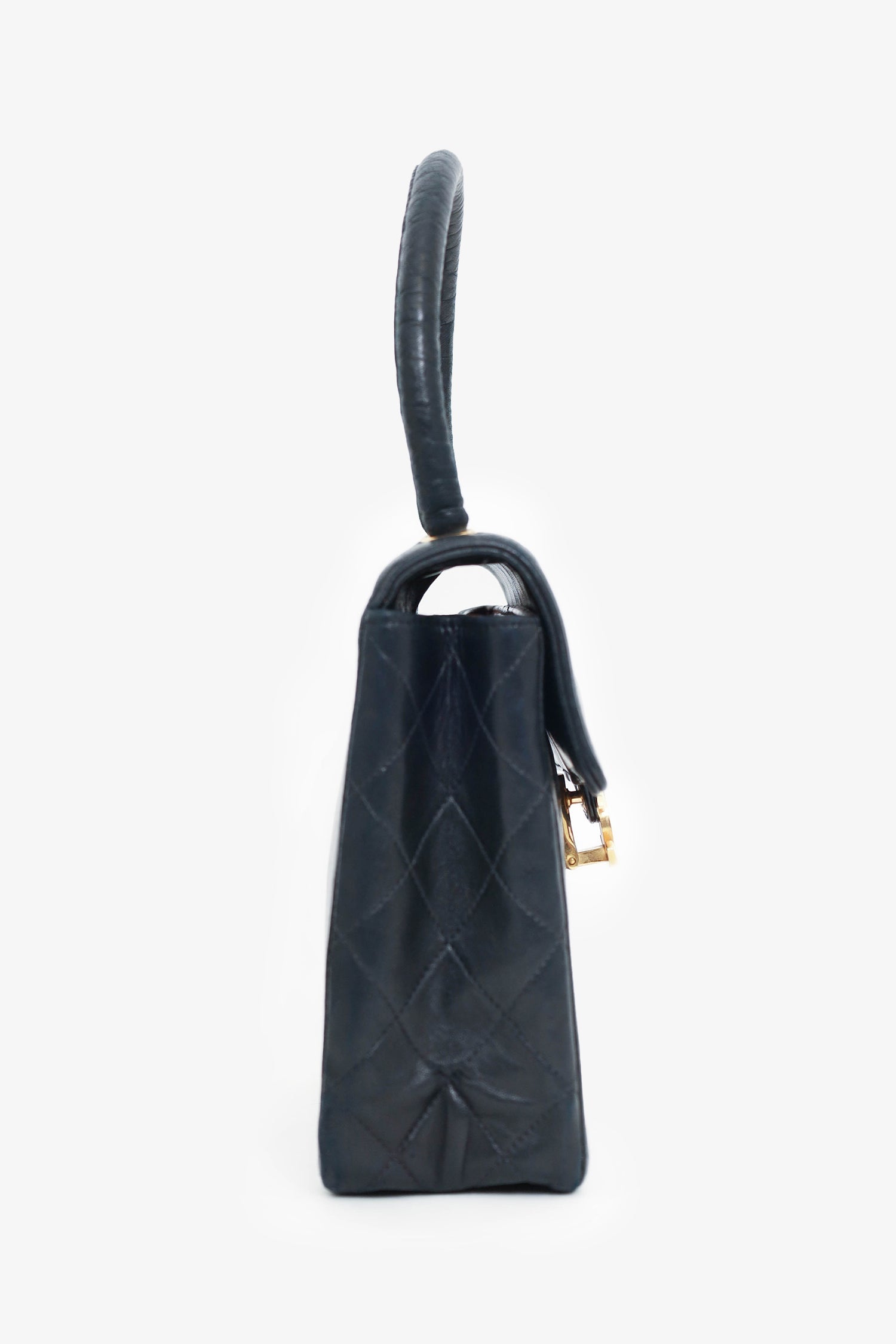 Chanel™ 1991-94 Black Vertical Quilted Lambskin Top Handle Bag