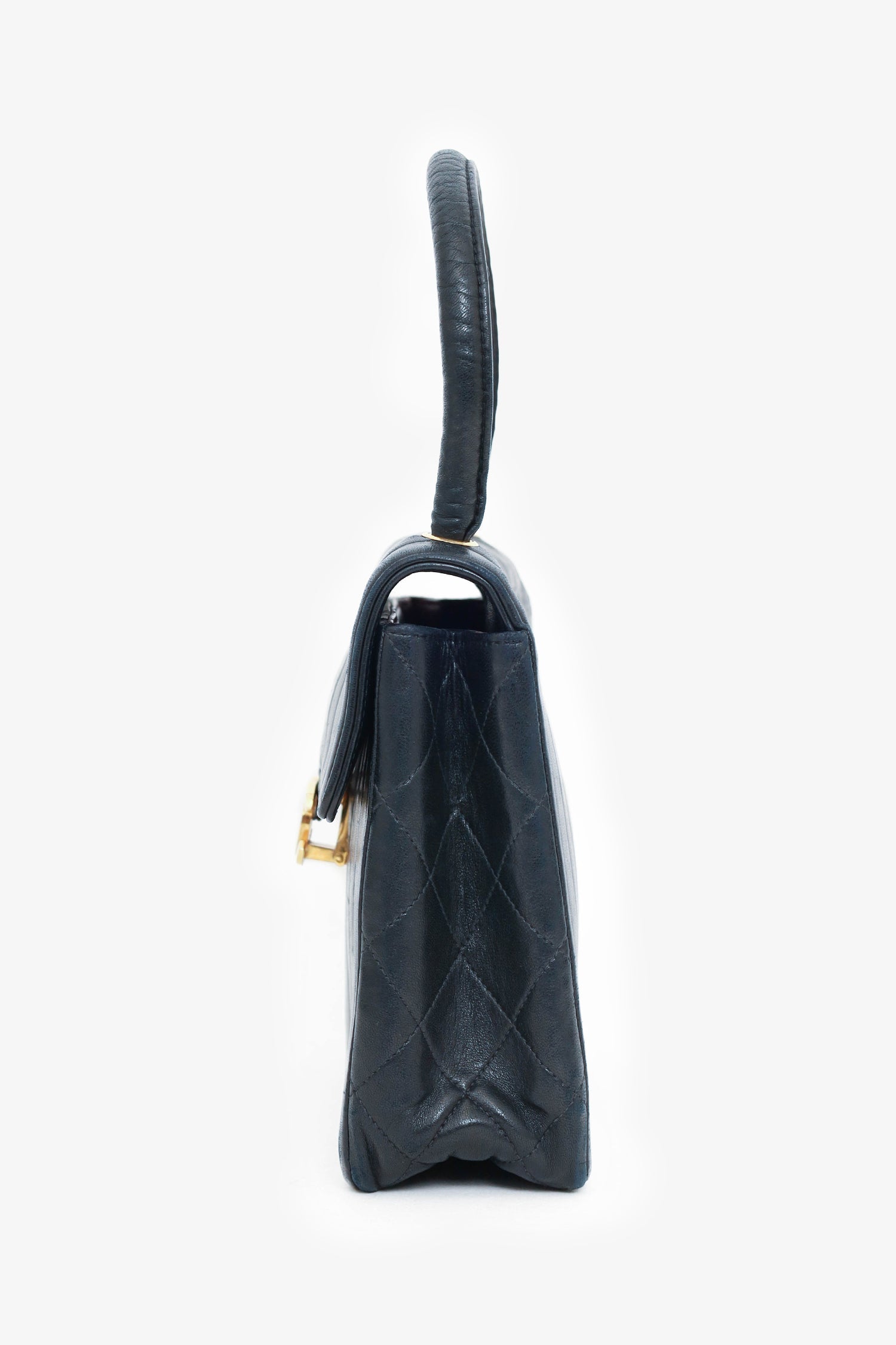 Chanel™ 1991-94 Black Vertical Quilted Lambskin Top Handle Bag