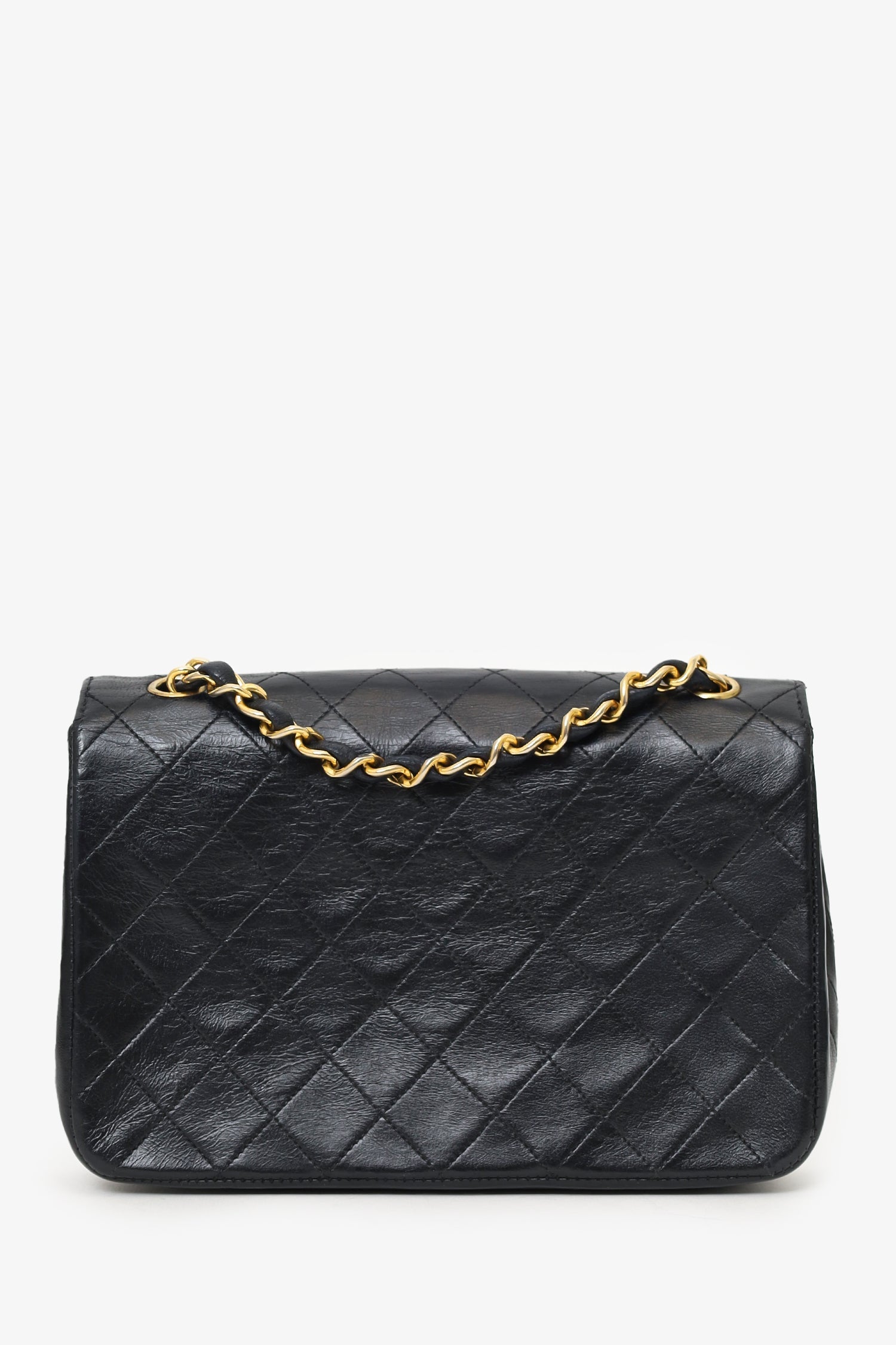 Chanel™ 1986-88 Black Quilted Lambskin Circle CC Mini Flap Bag