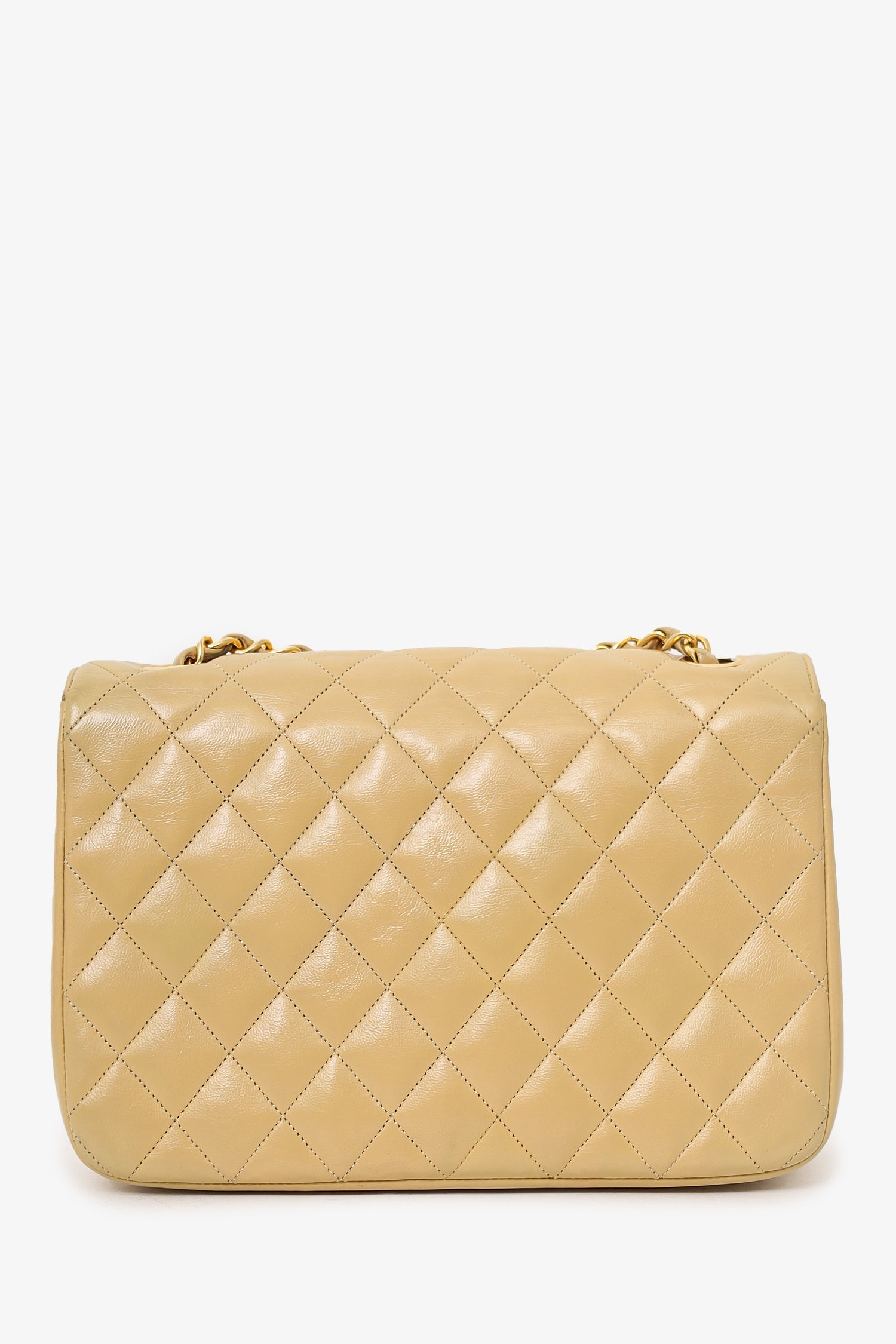 Chanel™ 1986-88 Beige Quilted Lambskin Half Moon Flap Bag