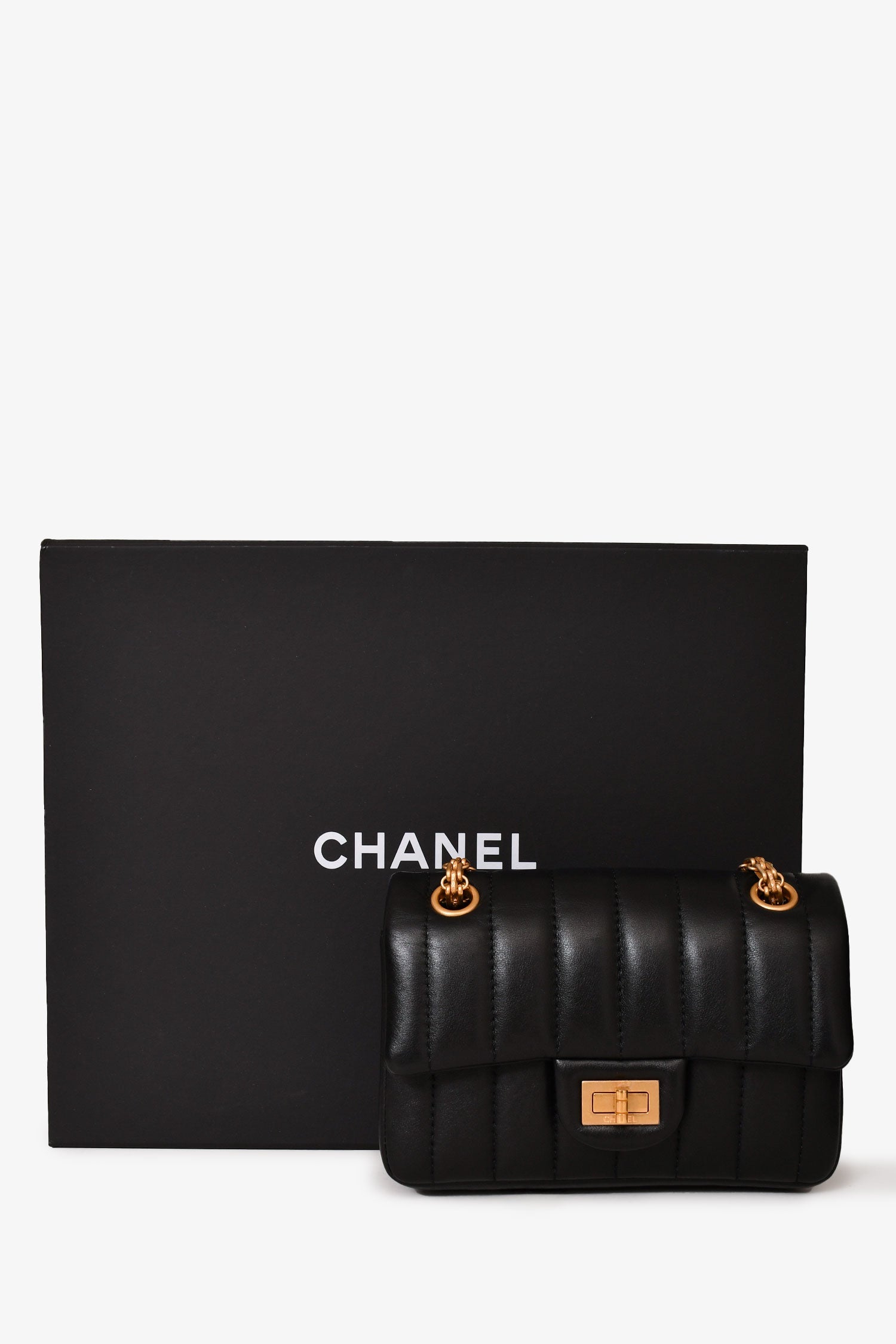 Chanel™ Black Leather Vertical Quilted 2.55 Mini Flap